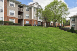The beautiful green expanses of grass before the the Riverwalk Apartments