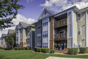 The well-maintained lawn and hedges around the Riverwalk Apartments.