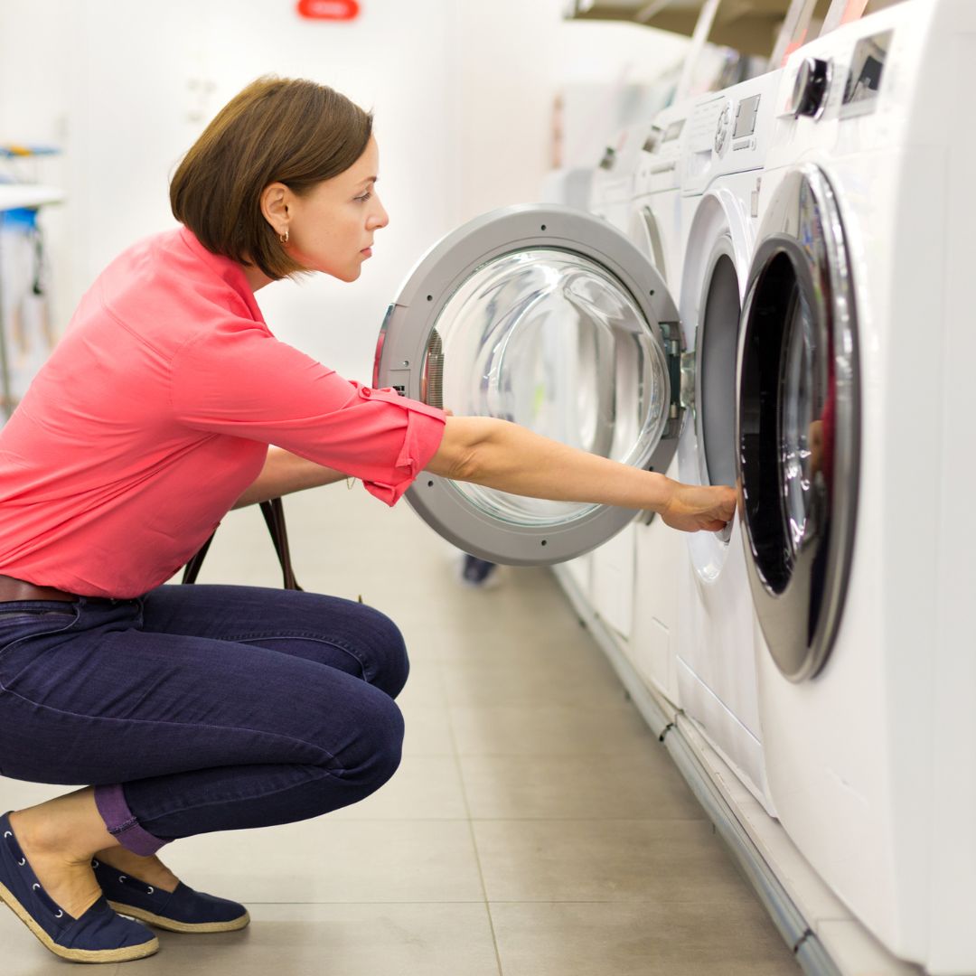 a woman doing laundry in a modern laundry room