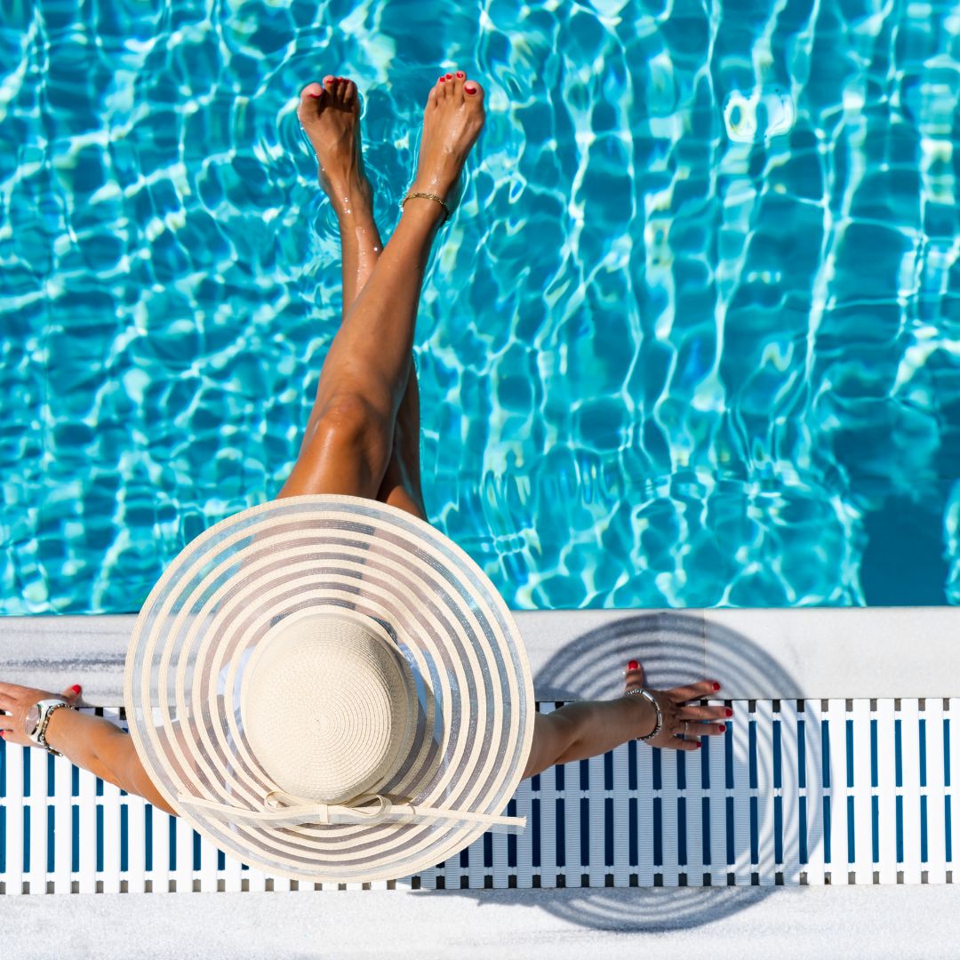 a person sitting by the pool