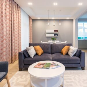 Room with nice lighting and white coffee table
