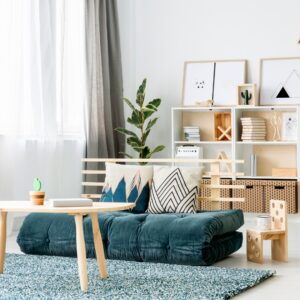 Blue futon in a neat room