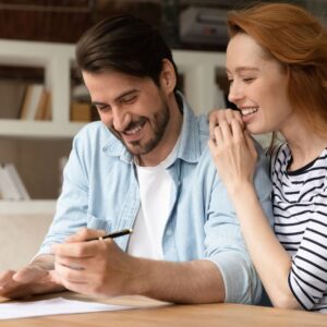 couple signing apartment lease