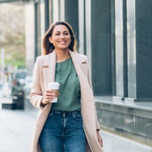 Woman walking with coffee