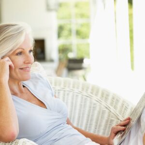 Woman sitting in patio chair