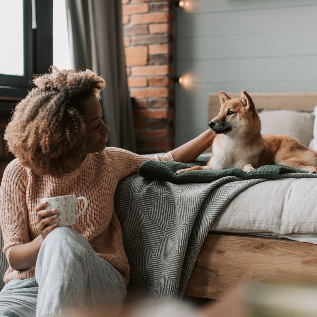 Dog owner and her pet in an apartment,