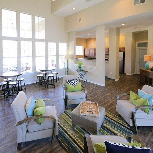 The bright, sunny and comfortable common room at the Riverwalk Apartments.